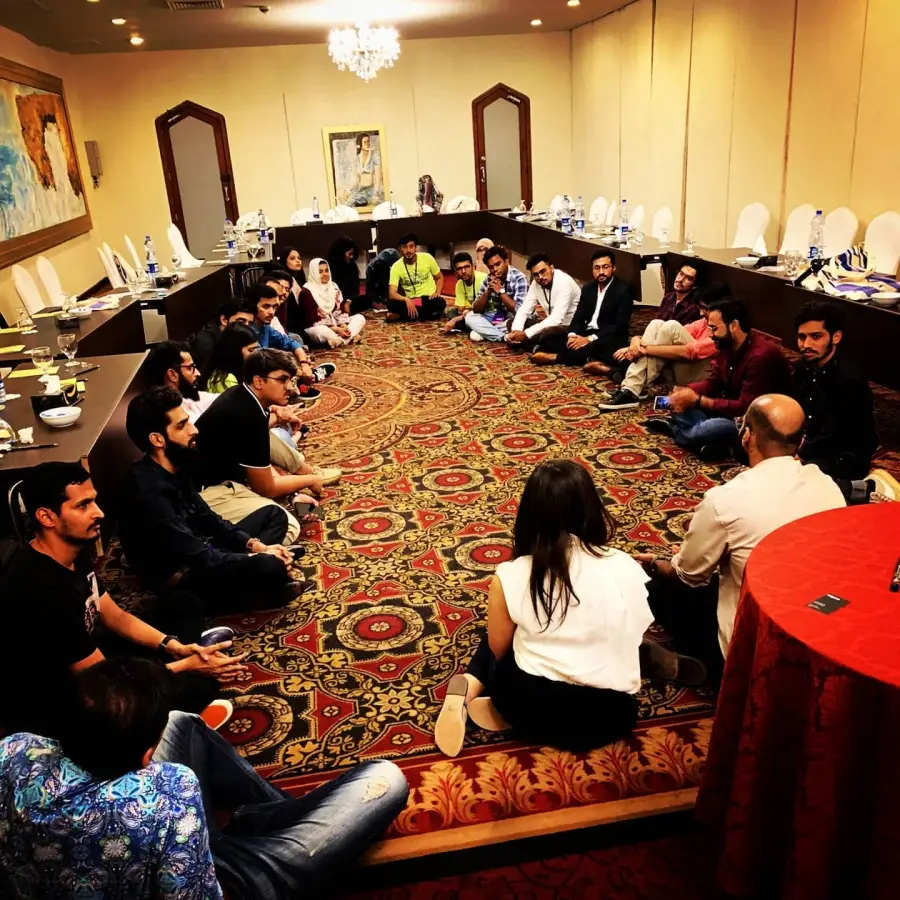 Participants seated in a circle during a workshop
